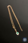 A 9ct gold emerald and diamond pendant on chain