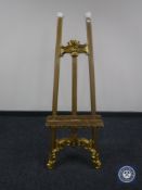 A gilt easel