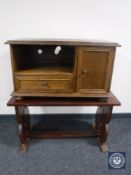 An oak TV stand and a refectory coffee table