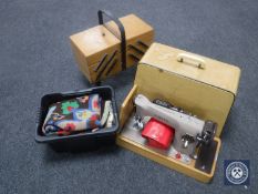 A cased Singer electric sewing machine,