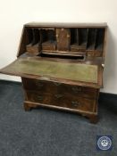 A 19th century inlaid mahogany bureau
