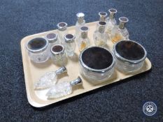 A tray of fifteen Avon perfume bottles and powder jars