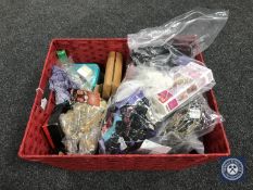 A basket containing a quantity of costume jewellery