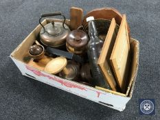 A box containing vintage glass bottle, wooden wall plaques, antique copper kettle,