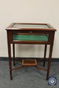 A mahogany and satinwood inlaid bijouterie table, width 57 cm. With key.
