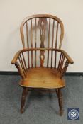 An antique elm and ash country chair, width 55 cm.