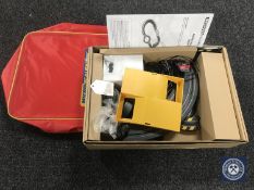 A micro Scalextric set in carry bag