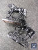 A pair of cast iron horse door stops