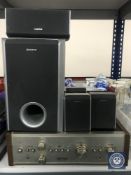 A Pioneer stereo amplifier model SA-6200 together with a set of Sony surround sound speakers