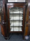 An Edwardian inlaid mahogany display cabinet