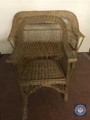 A wicker two seater settee and armchair