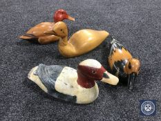 Four wooden decoy ducks