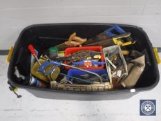 A large plastic crate of assorted hand tools, hard ware,