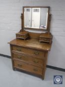 An Edwardian oak dressing chest