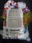 Four plastic storage crates containing dressing accessories,