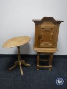 A continental oak pedestal occasional table,