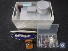 A basket containing a quantity of costume jewellery