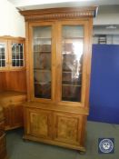 A late 19th century walnut glazed door bookcase CONDITION REPORT: 214cm high by