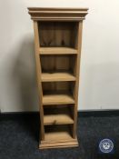 A set of narrow pine open shelves