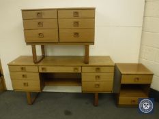 A four-piece Schreiber teak bedroom suite comprising dressing table, six drawer chest,