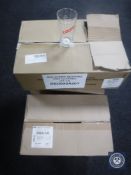 Seven boxes of unused pint glasses.
