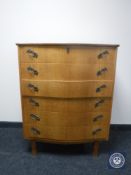 A continental oak serpentine fronted six drawer chest