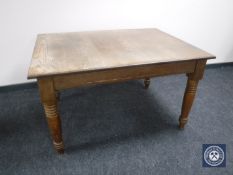 An early 20th century oak dining table
