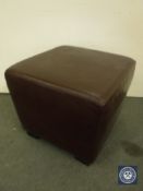 A Burgundy leather footstool