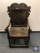 A carved oak Wainscot style armchair,