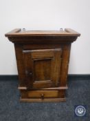 A 19th century oak wall cabinet fitted a drawer