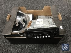 A box of car stereos and multi changer and a Peugeot badge