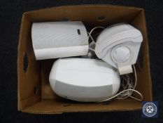 A box of three outdoor speakers