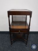 An antique mahogany miniature wash stand fitted a drawer