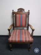 An early 20th century barley twist armchair