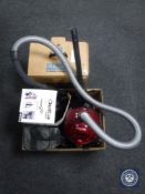 A box containing dirt devil vac,