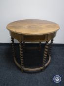 An oak barley twist D-shaped table fitted a drawer