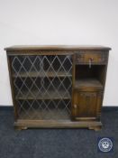 A Priory Oak sliding door bookcase