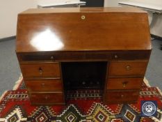 An early 20th century mahogany bureau,