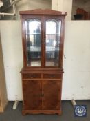 A yew wood display cabinet with cupboards and drawers CONDITION REPORT: 181cm high