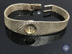 A lady's 14ct gold Omega wristwatch on integral gold bracelet CONDITION REPORT: Back