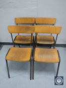 Four metal framed stacking school chairs