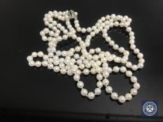 A cultured pearl two-strand necklace on silver clasp