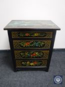 A 20th century oak hand painted four drawer chest