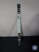 A Carneol glass wall clock, length 112cm.