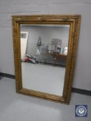 An early 20th century gilt and gesso overmantel mirror