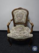 A continental oak framed armchair