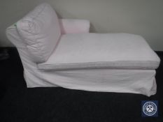 A contemporary chaise longue in pink loose cover