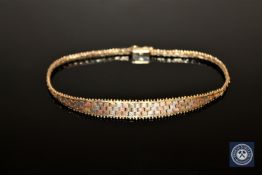 A 9ct gold tri-colour bracelet, length 18cm CONDITION REPORT: 5.