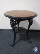 A Britannia pub table on cast iron base