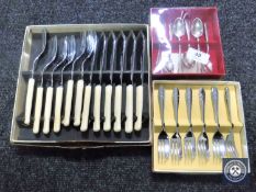 Three boxes of flatware to include fish cutlery,